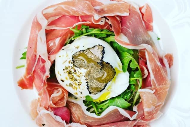 Top quality ingredients – the creamy burrata with Parma ham and rocket, topped with luxurious black truffle shavings