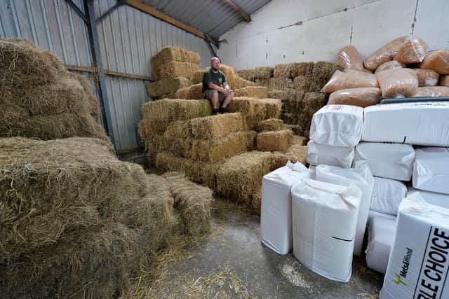 Gary seen with the bedding and hay inside the huge store