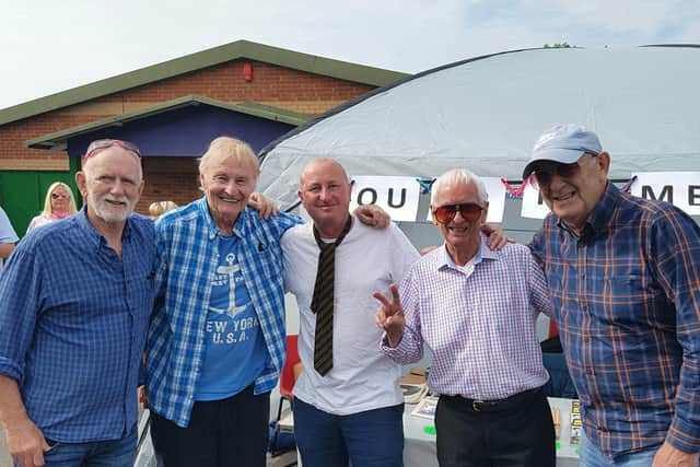The Quarrymen with festival organiser Mark Moran, centre