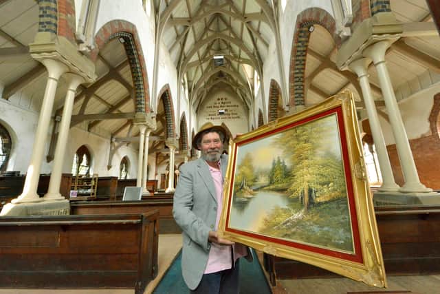 Dave Usher gets ready to open the new antiques emporium