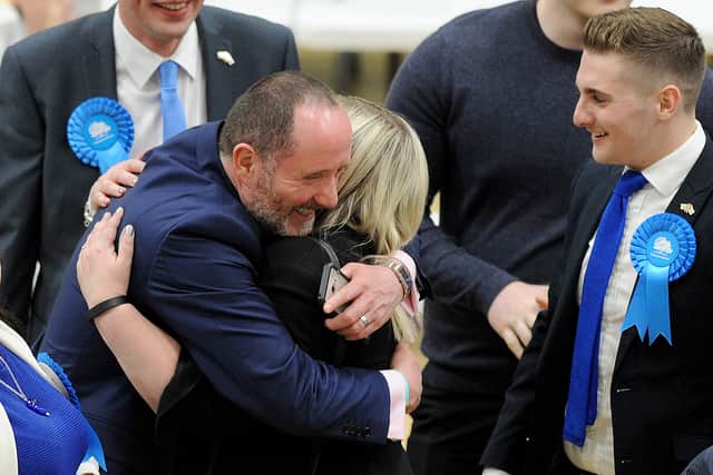 Walsall North MP Eddie Hughes hugs Louise Harrison, who held onto her Bloxwich West seat