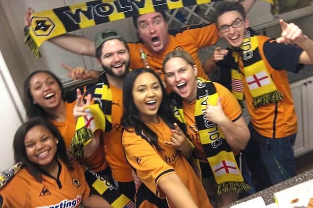 British expatriate Michael Long, from Tettenhall, holds up a scarf with his ‘Wolves family’
