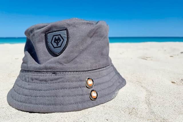 Wherever I lay my hat – a Wolves hat positioned on a sunny beach