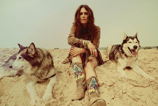 My Indigo, AKA Sharon Den Adel, poses with some four-legged friends