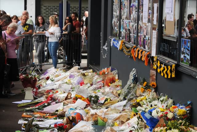 Flowers left in tribute to Mr Passey outside Chicago's