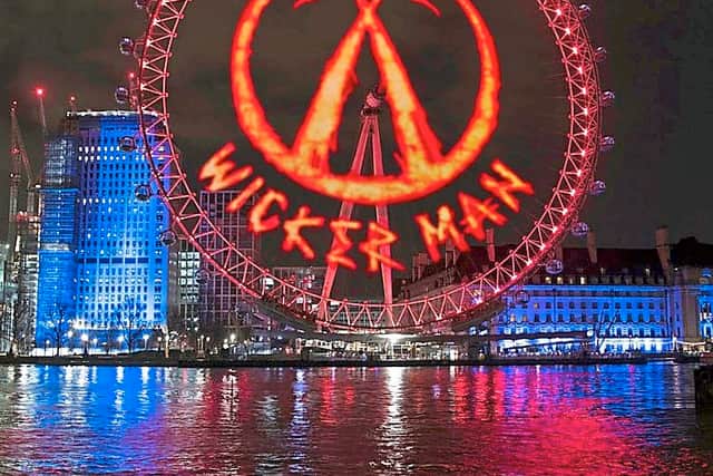 Wicker Man burning logo projected onto the London Eye