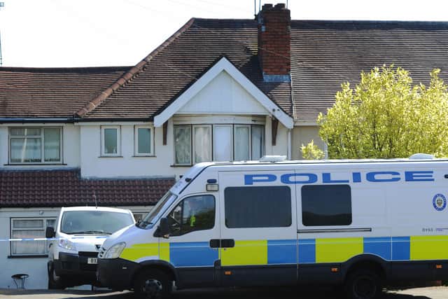 Police outside the hostel in Highgate Road, where Miss Bills was found