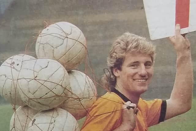 Micky Holmes poses with a ball for every one of his seven consecutive goals