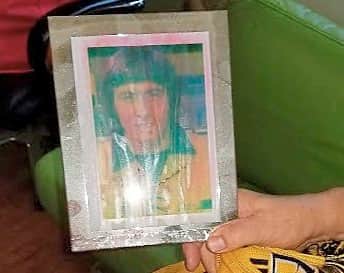 His damaged signed picture of John Richards