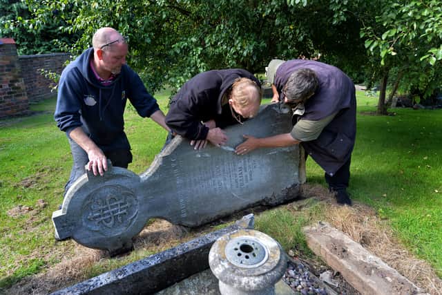 Right, Gary Stapleton and the Victoria Cross Trust check the face of the stone