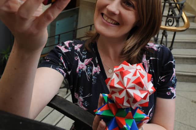 Vickie Warren with some of the mystery origami
