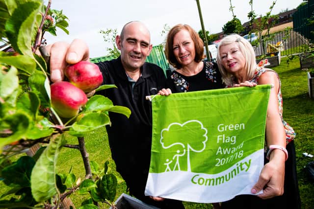 Darren Gilbert, Alison Bate and Judy Worton in the edible garden