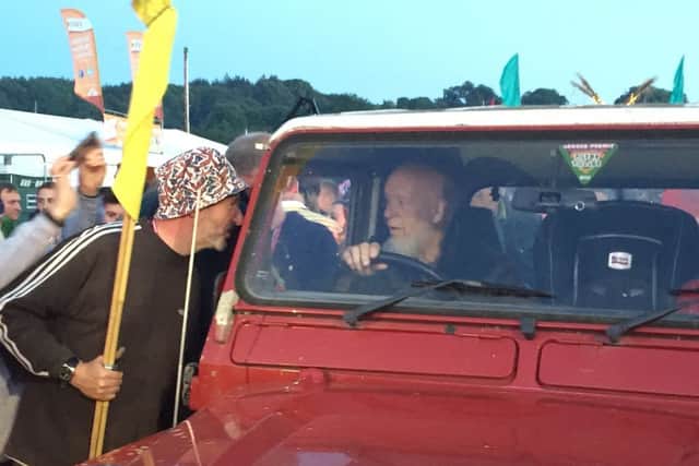John Holding with his Wolves flag when he met Michael Eavis, Glastonbury Festival foudner