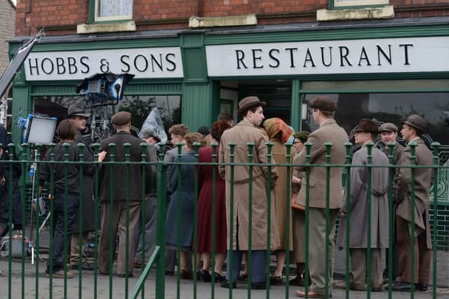 Coogan was escorted into Hobbs Restaurant in between takes