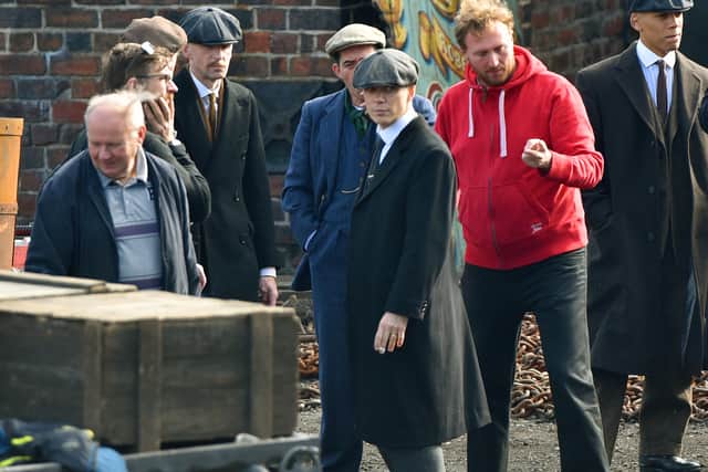 Cillian Murphy and co-stars during filming for Peaky Blinders at the museum