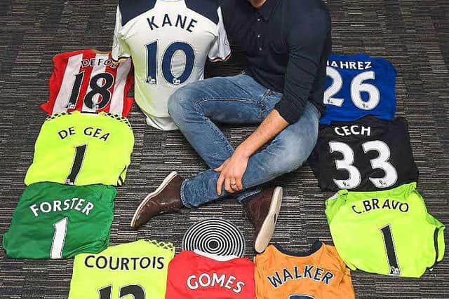 Ben Foster with some of the shirts that are being sold off to raise money for charity