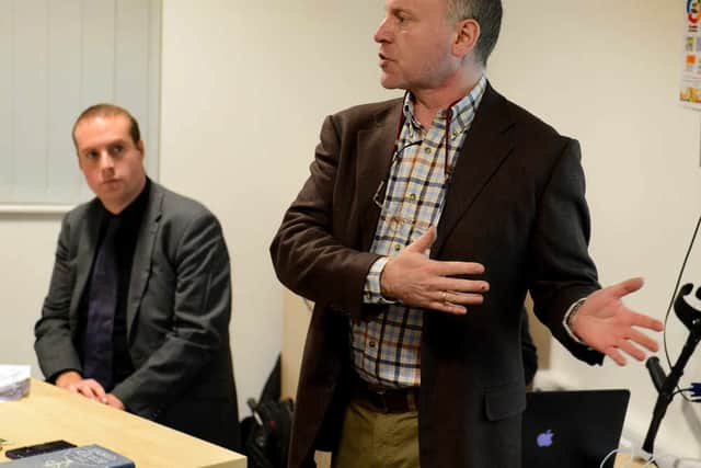 Chairman for the meeting councillor Marco Longhi stands next to councillor Oliver Bennett