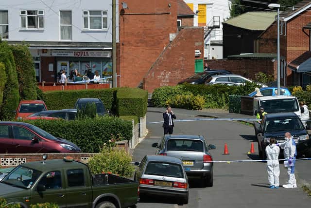 Forensic officers at an address in Meadow Close after the tragedy
