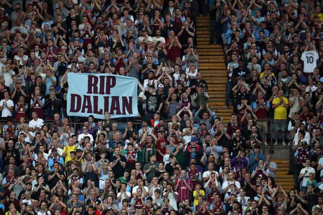Fans applaud on the 10th minute, in memory of former player Dalian Atkinson