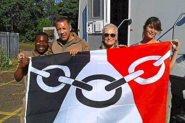 The stars holding the Black County Flag on location