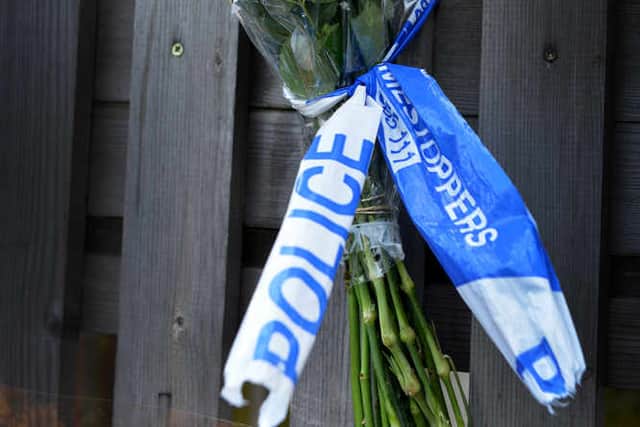 Flowers left outside the Queens Head pub