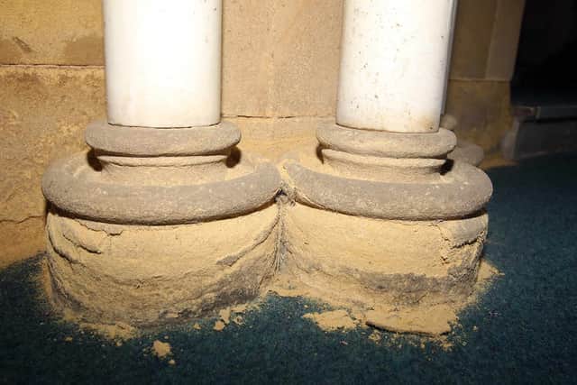 Damp on the pulpit which has eroded the brickwork