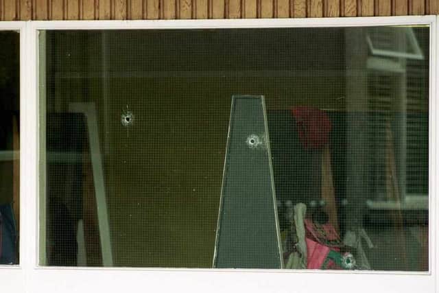 Bullet hols in the windows of Dunblane Primary School