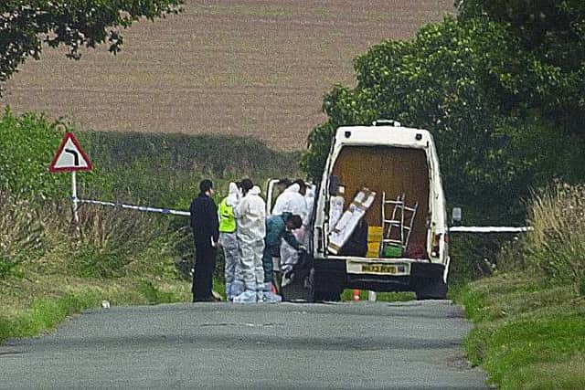 Police officers in Clive Road, Pattingham, near Wolverhampton, where the bullet-riden body of Kevin Nunes was found in 2002