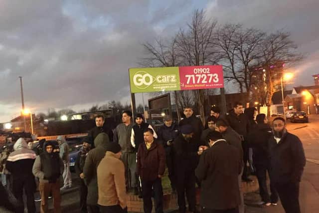 Some of the protesting taxi-drivers outside the Go Carz offices