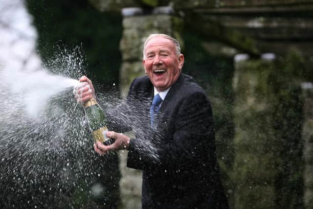 Vic Eden celebrates with Champagne