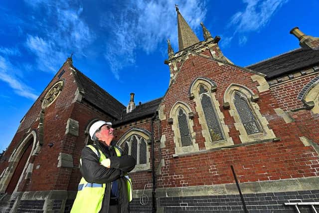 John Woodall surveys the outside of the restored chapel