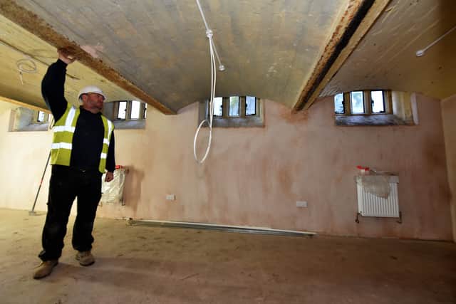 Site manager Andy Hutchings in the basement where bodies used to be kept, and will now be a storage room