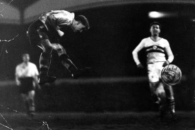 Roy Swinbourne heads a goal against Honved