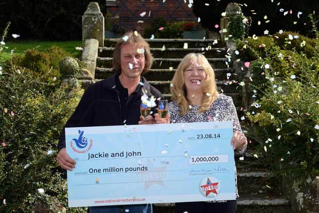 Celebration time: John Potter and Jackie Murphy with their £1 million cheque