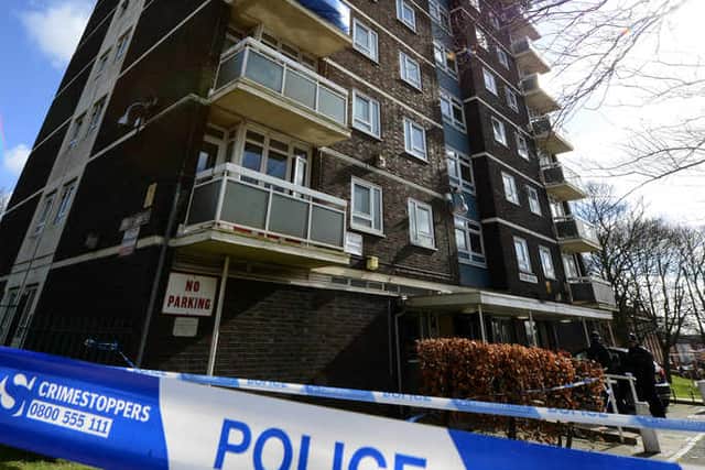 The scene at Wood House block of flats following the fall