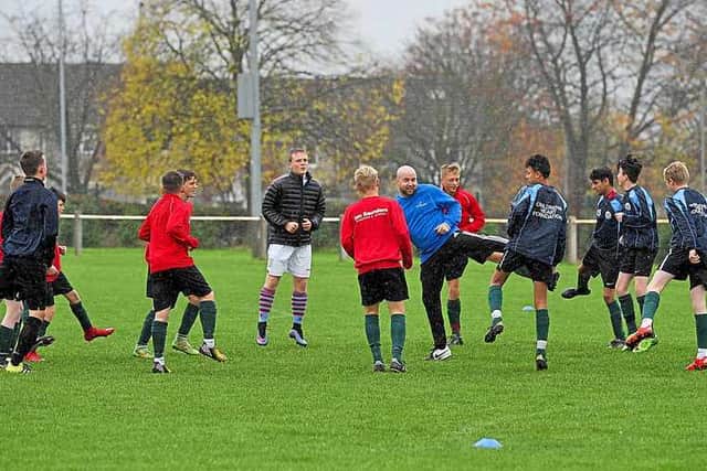 A group of young hopefuls limber up at Lichfield FC, as plans for Steve Staunton's academy are unveiled.