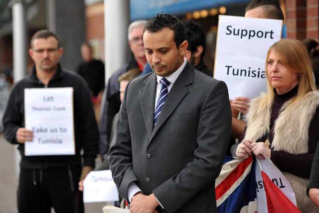 Chairman Mehdi Bahi and members of the Tunisian Association hold a minutes silence in memory of victims of the terror attacks in the country
