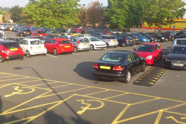 Cradley Heath Station Car Park, and this driver's blocking a disabled space
