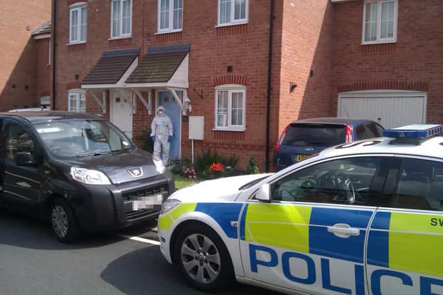 A forensic officer at the house