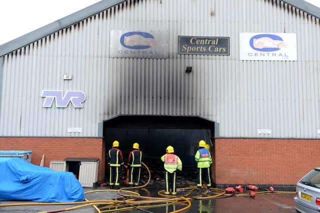 Damage can be seen to the front of the Central Sports Cars garage