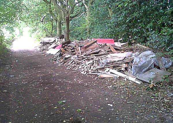 Pallets, household rubbish and building waste dumped in Aldridge