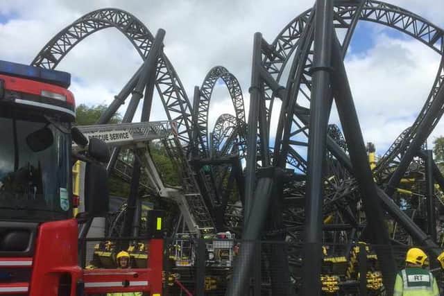 Rescue workers help those trapped on the ride, picture: West Midlands Ambulance Service