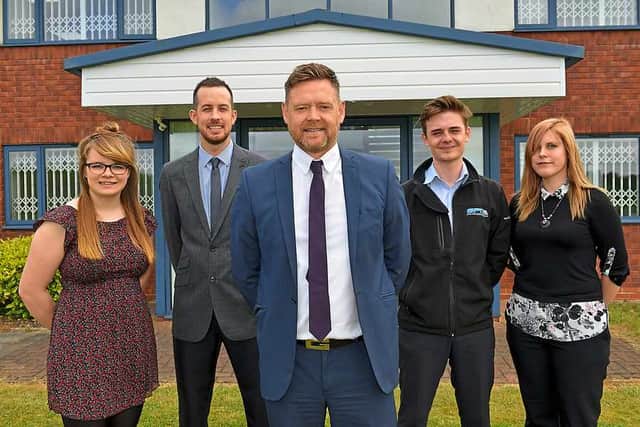 Nick Liggins, of Steel Processing Ltd with apprentices and former apprentices