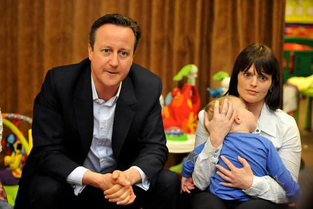 David Cameron with Natalie Taylor and Joshua Newman, aged two