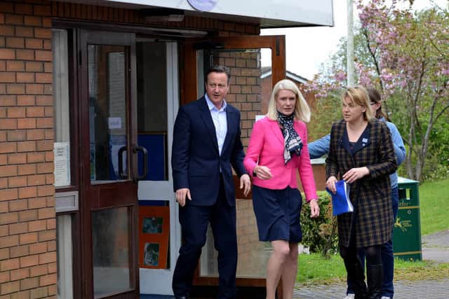 David Cameron leaves the nursery with Conservatdive parliamentary candidate Amanda Milling