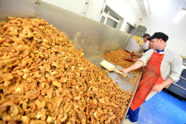 Scratchings being prepared for packing at Black Country Snacks, Commercial Road, Walsall.