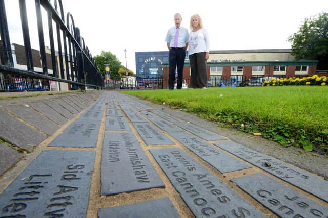 Mike Mellor, treasurer and vice chair of CHAPS, and Sheila Harding, secretary of CHAPS, next to the miners memoria stones in Market Street, Hednesford