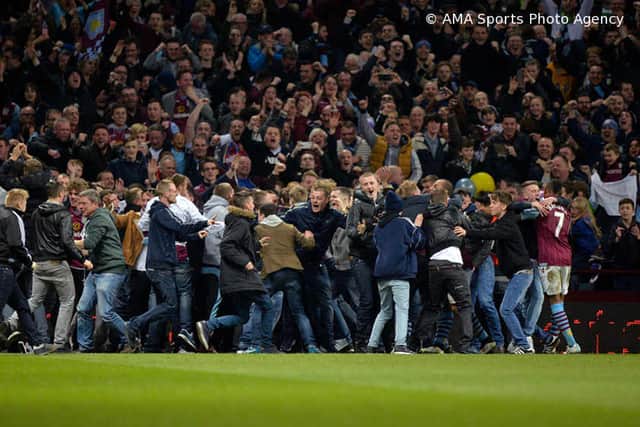 Aston Villa fans invade the pitch during the match after Scott Sinclair scored Villa's second goal