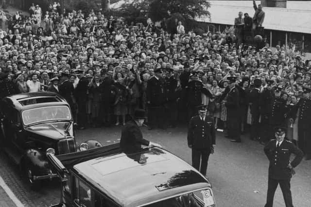 29 Jul 1949 - A police cordon was required to keep the crowds back both at the Victoria Hotel and outside Molineux Grounds. This picture shows Mr Churchill arriving at the football ground to make his speech.