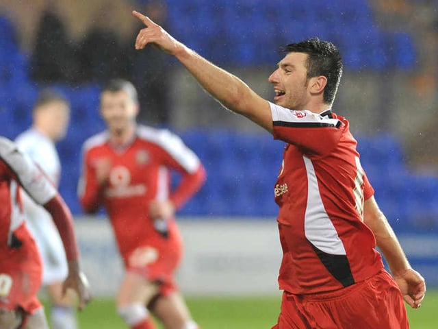 Michael Cain celebrates after scoring a vital goal for Wembley-bound Walsall at Tranmere in the JPT Trophy.